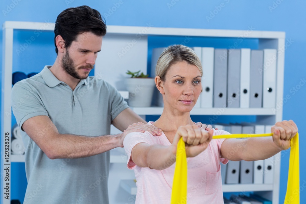 Fototapeta premium Physiotherapist giving shoulder massage to patient