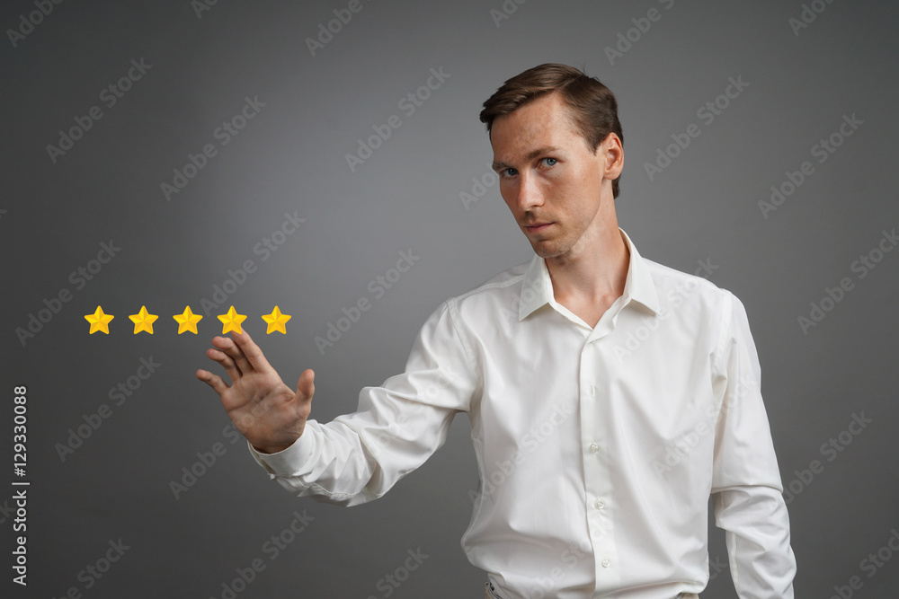 Five star rating or ranking, benchmarking concept. Man assesses service, hotel, restaurant Five star rating or ranking, benchmarking concept. Man assesses service, hotel, restaurant