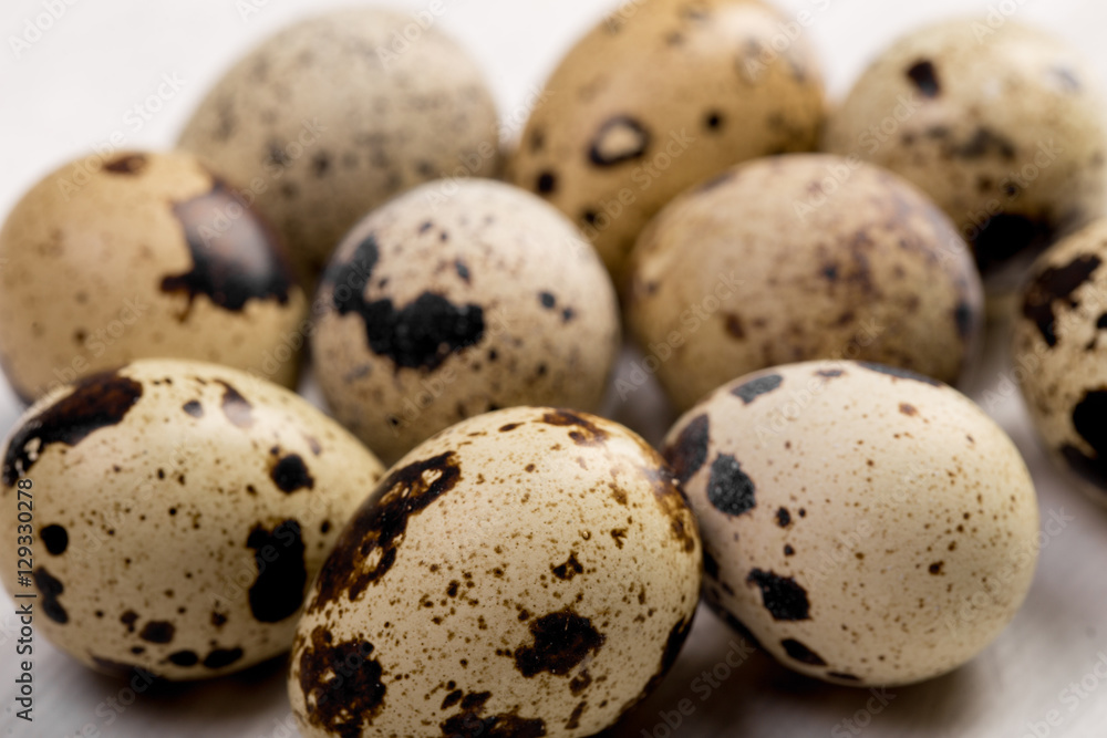 Food: group of quail eggs and egg, isolated on white background