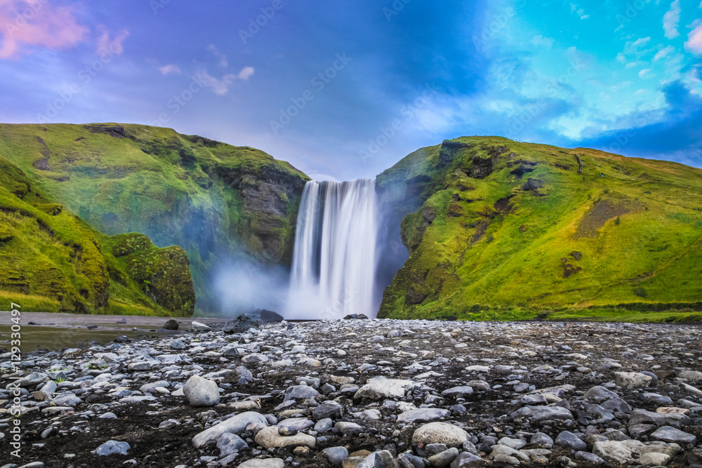 Fototapeta premium Classic view of famous Skogafoss waterfall in twilight, Iceland