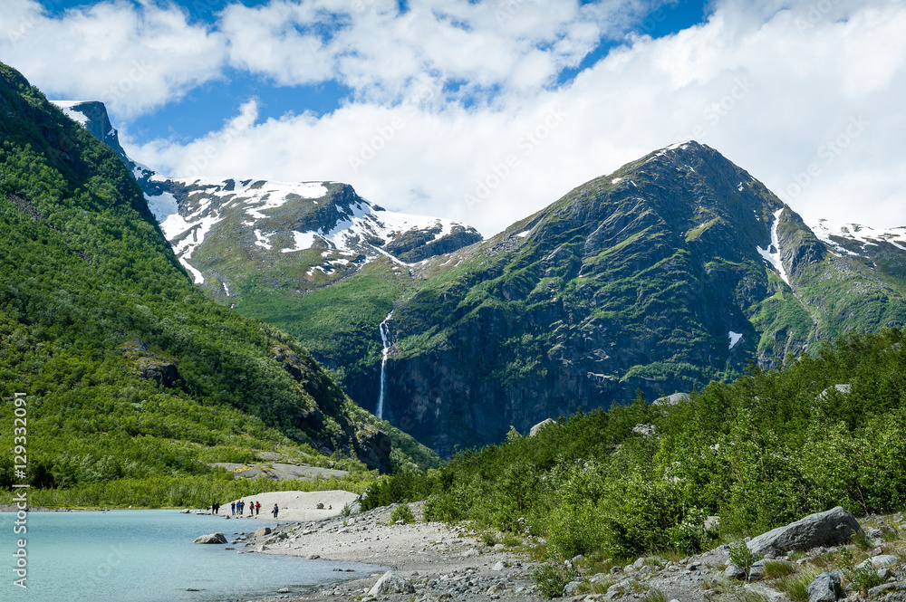 Tourists at Briksdalsbreen glacier viewpoint, Norway.