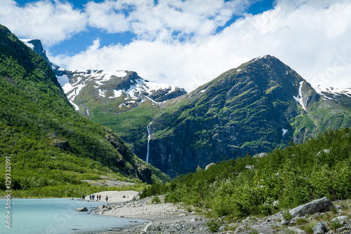 Tourists at Briksdalsbreen glacier viewpoint, Norway. © AlexanderNikiforov