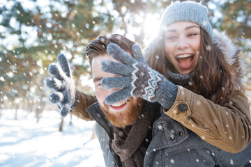 Couple having fun in winter park