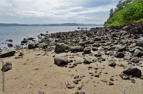 The volcanic Playa Sombrero Obscuro beach in Peninsula Papagayo in Guanacaste, Costa Rica photo