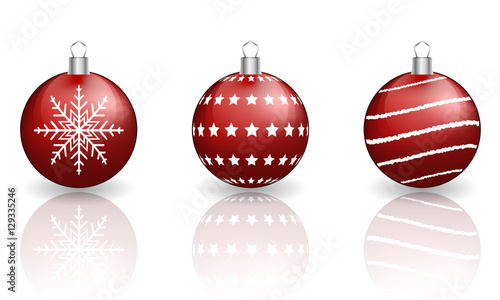 Red christmas baubles on white background.