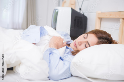 Asian woman sleeping on the bed