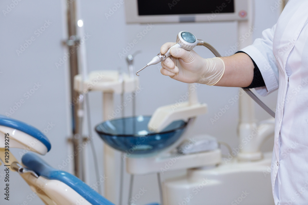 Dentist doctor hand holding medical tools in dental office. Concept of healthy Dentist doctor hand holding medical tools in dental office. Concept of healthy