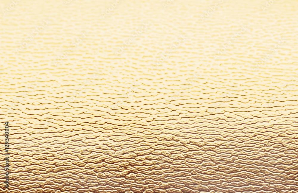 Holidays golden metallic corrugated textured background Holidays golden metallic corrugated textured background
