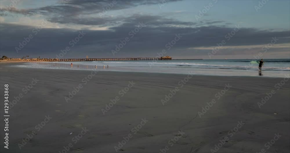 Panning time lapse near the jetty at Seal Beach, California. With dramatic clouds, fast moving waves, and off shore container ships Panning time lapse near the jetty at Seal Beach, California. With dramatic clouds, fast moving waves, and off shore container ships