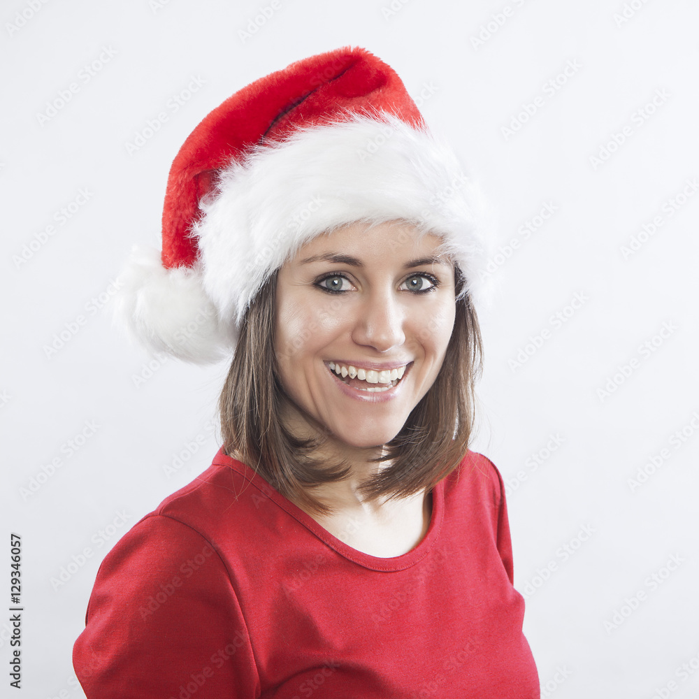 beautiful woman wearing Santa's hat, cheerful face expression beautiful woman wearing Santa's hat, cheerful face expression