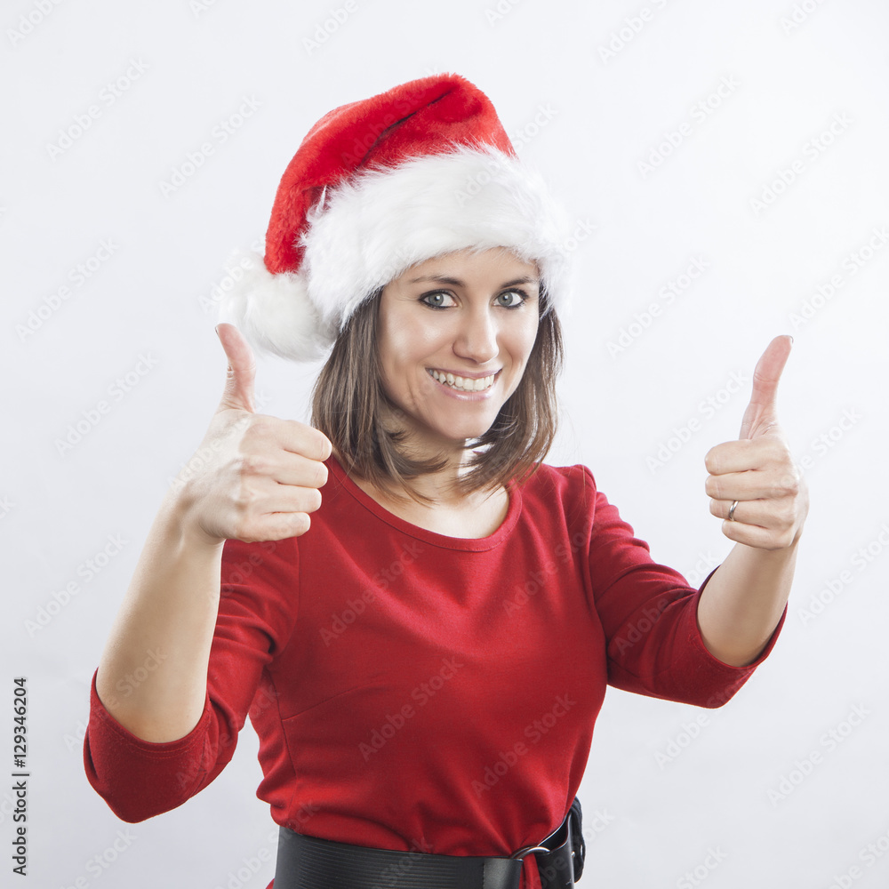 beautiful woman wearing Santa's hat, thumbs up beautiful woman wearing Santa's hat, thumbs up