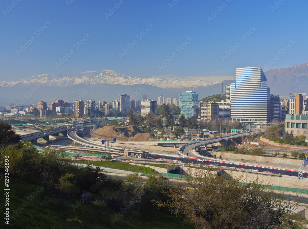 Chile, Santiago, View from the Parque Metropolitano towards the high raised buildings in financial sector. Snow covered Andes in the background.