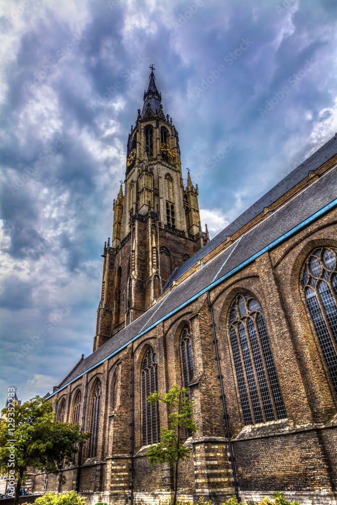 The Nieuwe Kerk - New Church in Delft in the Netherlands and cloudy sky.