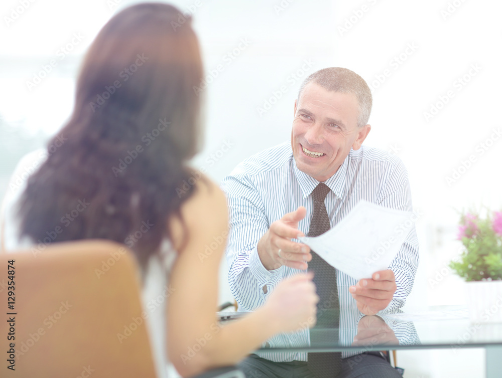 Fototapeta premium boss discusses with the assistant business documents in the offi