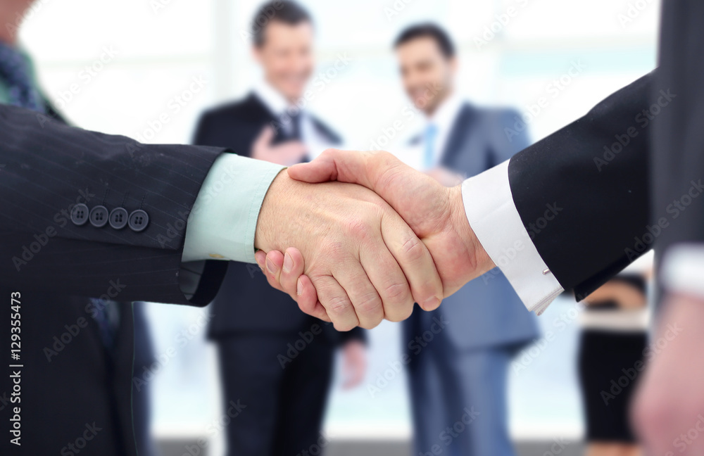 Concept of partnership - handshake  business partners