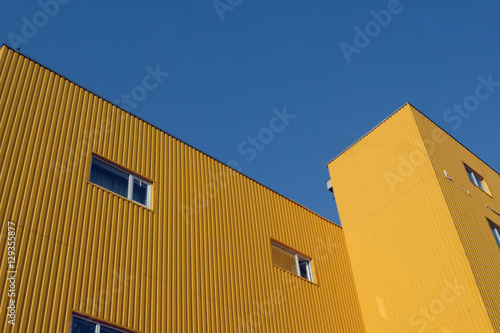 Contour of sky above yellow building