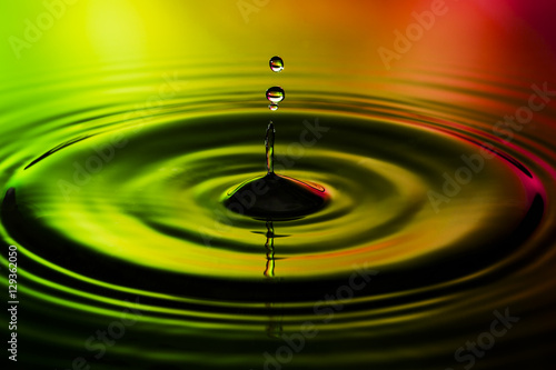 Abstract photo of water drops on nice red yellow green background. Nice texture and design photo