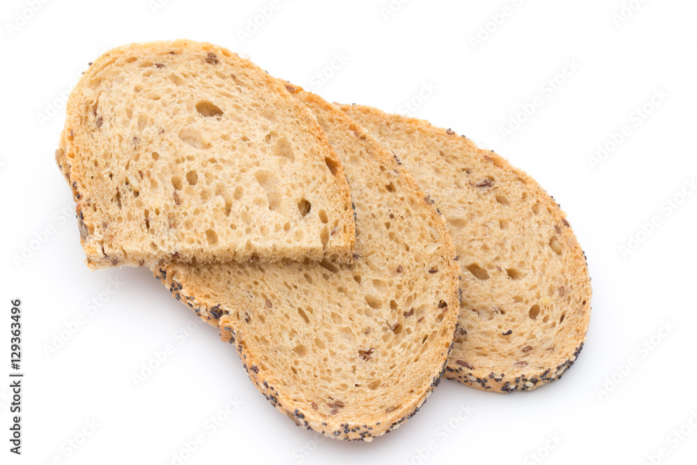 White bread sliced wholegrain bread on a wooden table.