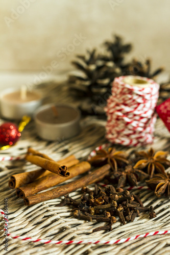 Fototapeta Naklejka Na Ścianę i Meble -  Anise, cinnamon, cloves. Christmas spices for gingerbread. Beige background.