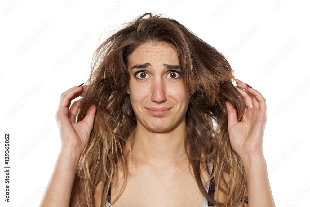 Portrait nervous stunned girl with messy hair Portrait nervous stunned girl with messy hair