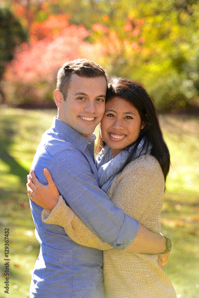 Young couple in love in an autumn setting Young couple in love in an autumn setting