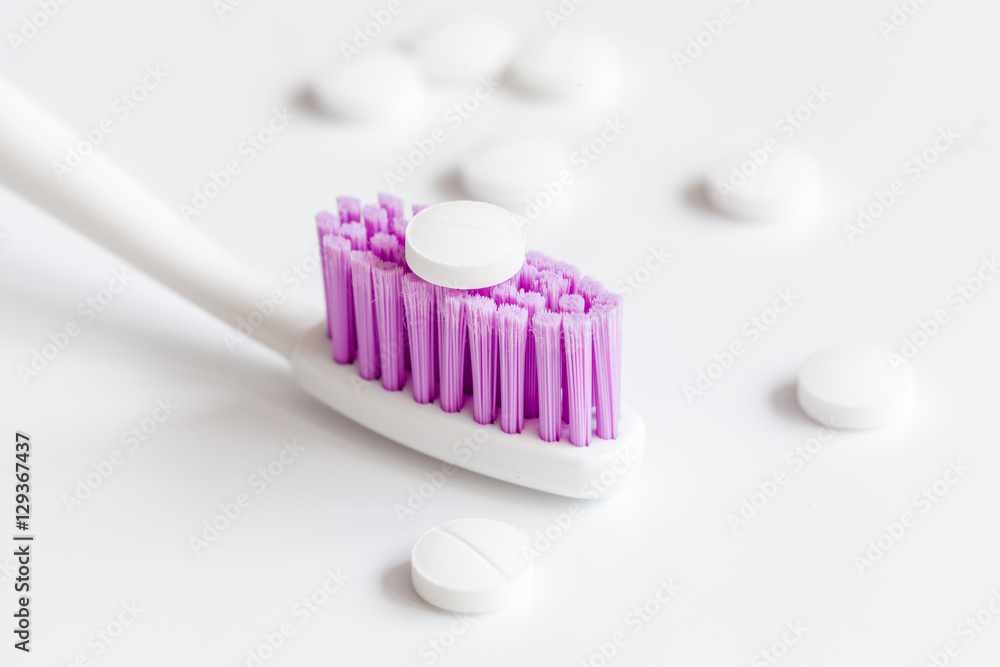 concept toothache with toothbrush and pills at white background concept toothache with toothbrush and pills at white background