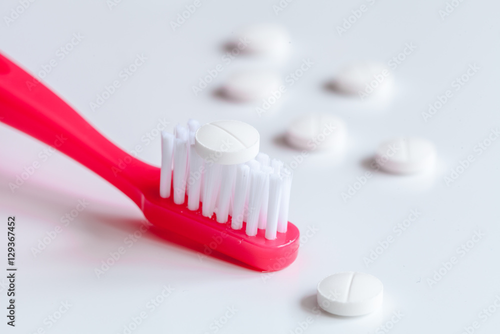 concept toothache with toothbrush and pills at white background concept toothache with toothbrush and pills at white background