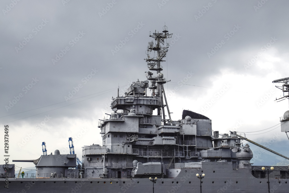 Part of the deck of a warship. communication devices and deck guns. Part of the deck of a warship. communication devices and deck guns.