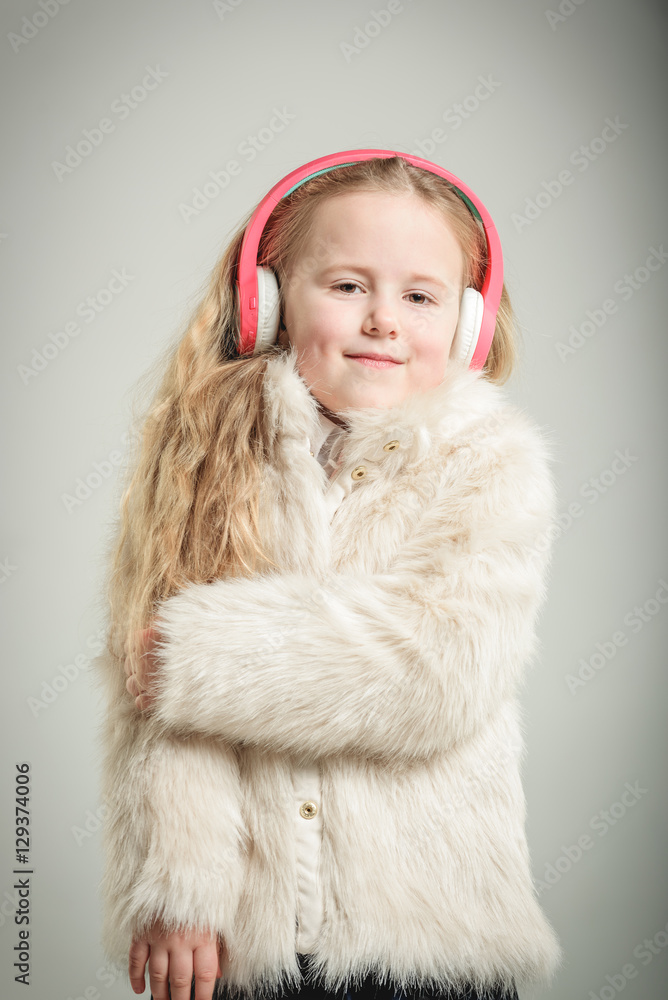 Party girl in pink fur coat and headphones. Party girl in pink fur coat and headphones.