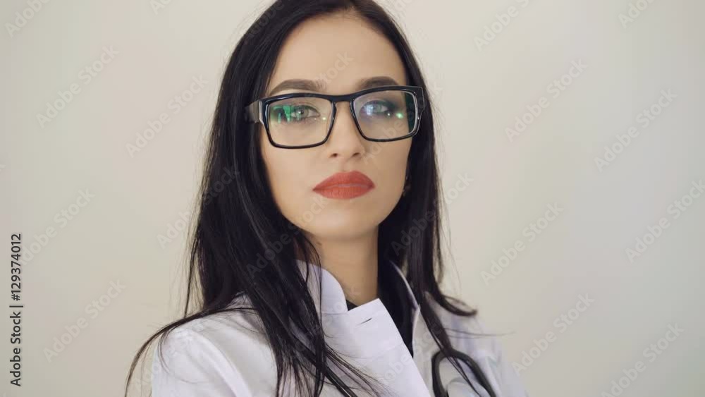 Portrait of pretty confident female doctor looking to camera 4K Portrait of pretty confident female doctor looking to camera 4K
