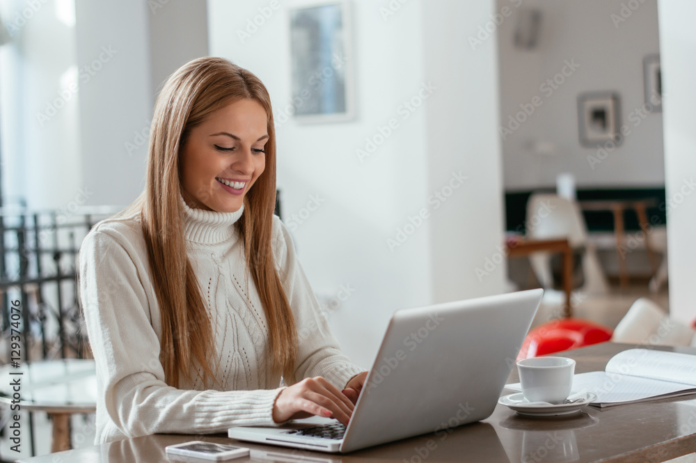 Business woman working on laptop computer at office Business woman working on laptop computer at office