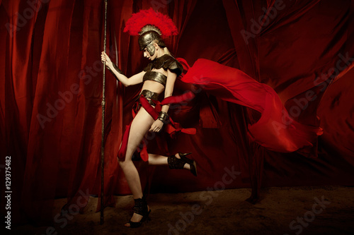 Woman in armour and helmet holding spear