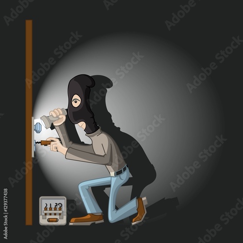 a thief in a black mask with master keys in the door lock breaks