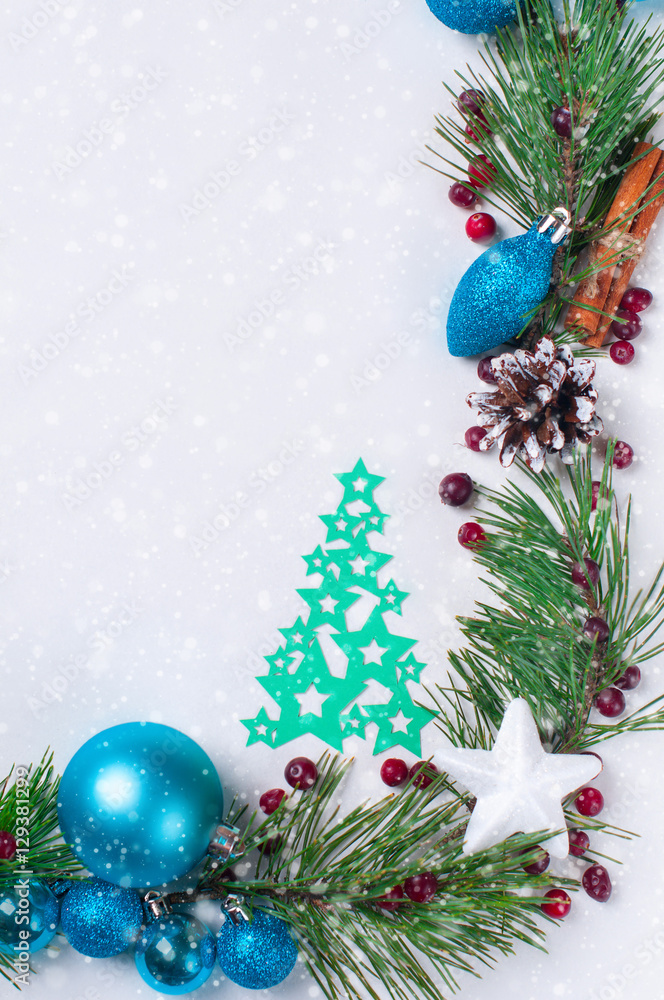 Obraz premium Christmas decoration pine branches cones Christmas balls paper Christmas trees white background