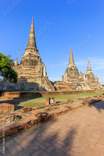 Young woman praying to giant reclining buddha statue at Wat Lokayasutharam  Ayutthaya Historical Park  Ayutthaya  Thailand.