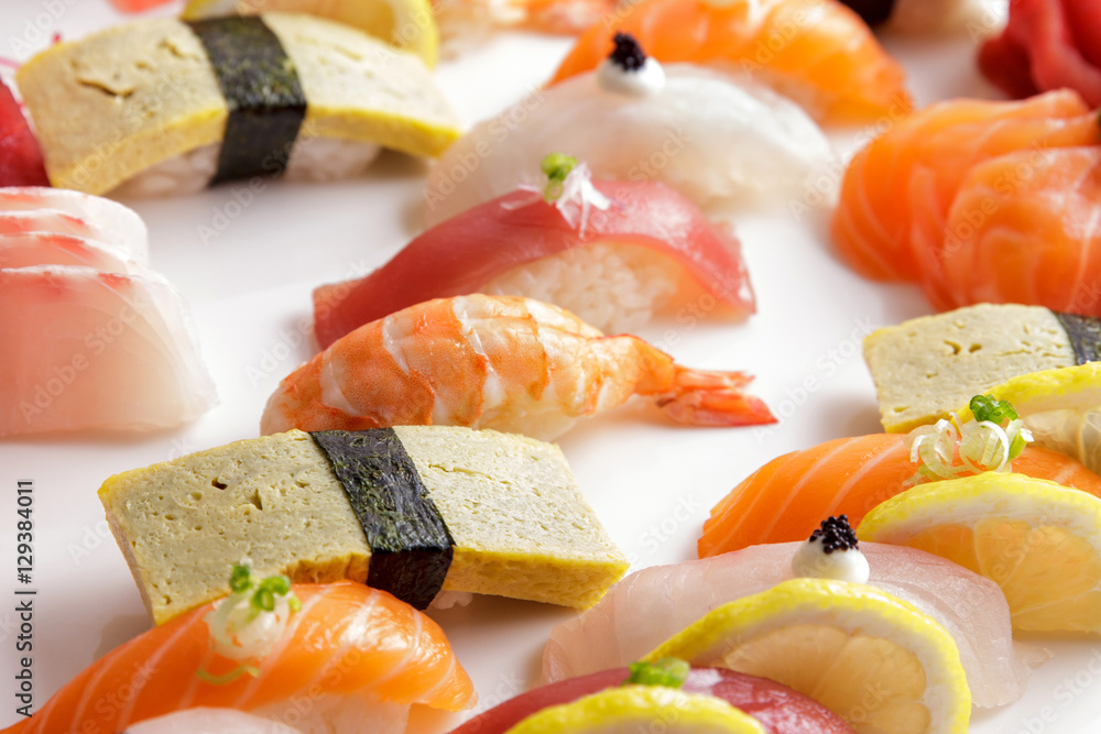 various of nigiri sushi on white plate various of nigiri sushi on white plate