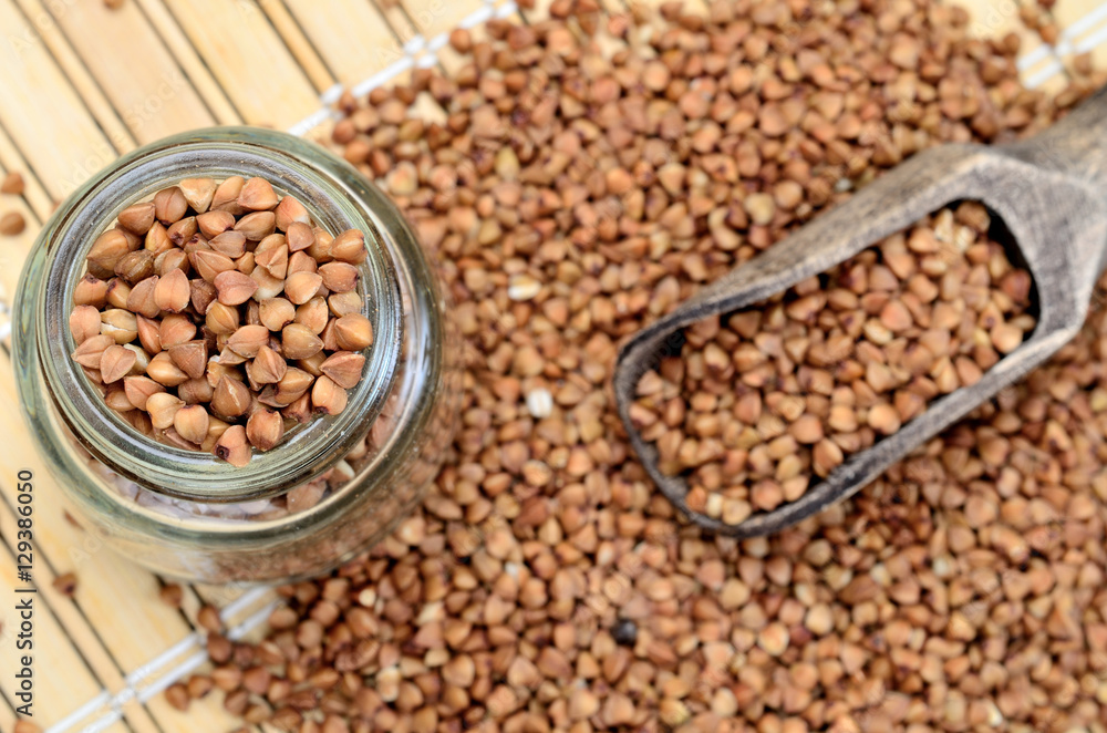 Obraz premium brown buckwheat on table