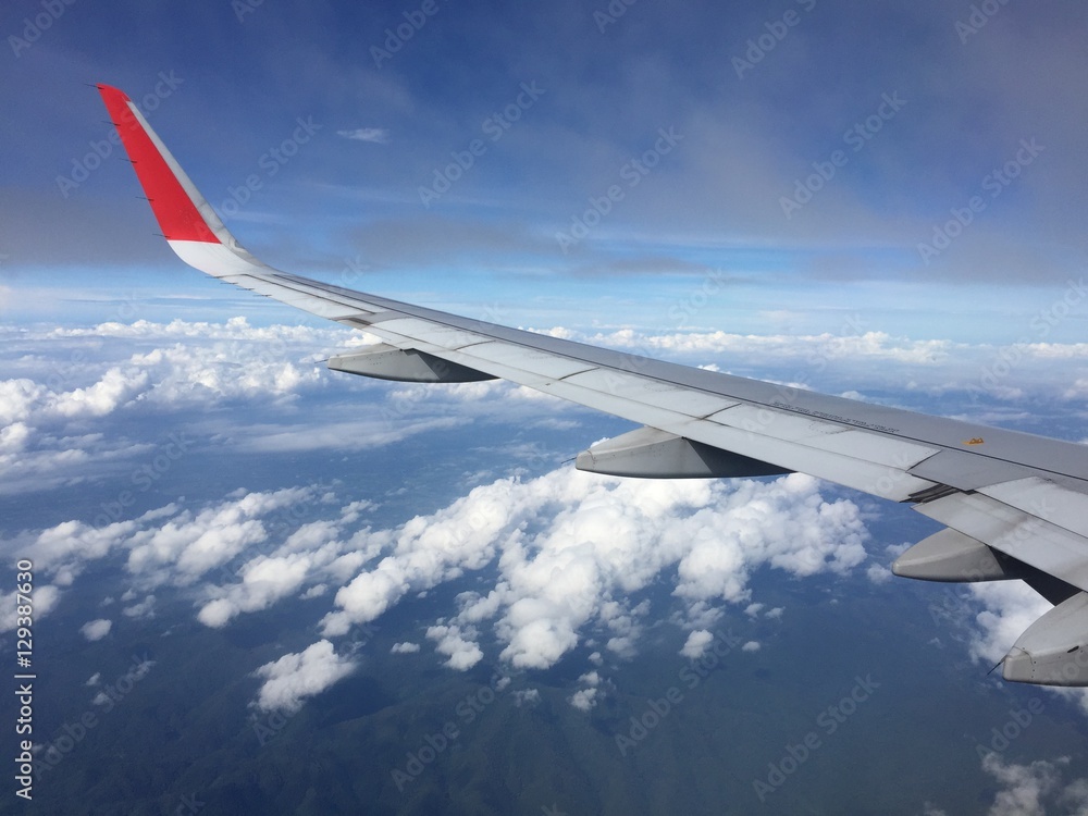 View of clouds from the airplane.Aerial view of cloud and blue sky with wing's airplane.Traveling and journey concept. View of clouds from the airplane.Aerial view of cloud and blue sky with wing's airplane.Traveling and journey concept.