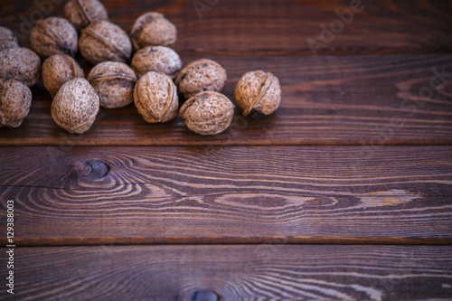 Natural walnuts on a wooden background. copyspace