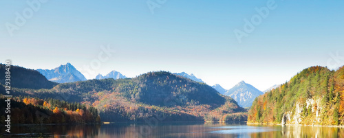 Fototapeta Naklejka Na Ścianę i Meble -  Mountain autumn landscape with colorful forest. Blue sky.