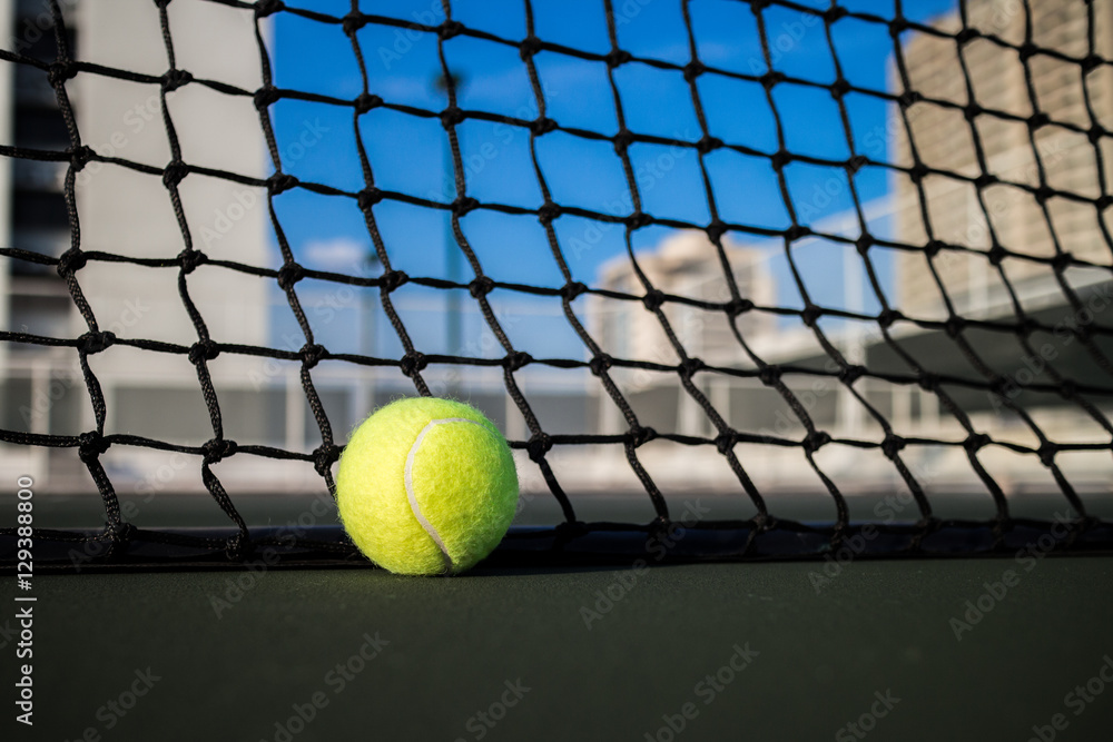 Tennis ball on hard court