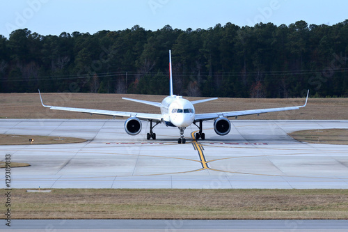 Fotografie Jet Passenger Airplane - on runway, taxi