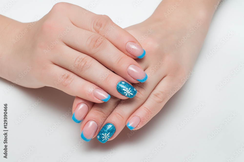 Christmas blue french manicure with white snowflakes Christmas blue french manicure with white snowflakes