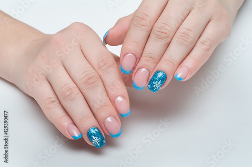 Christmas blue french manicure with white snowflakes 
