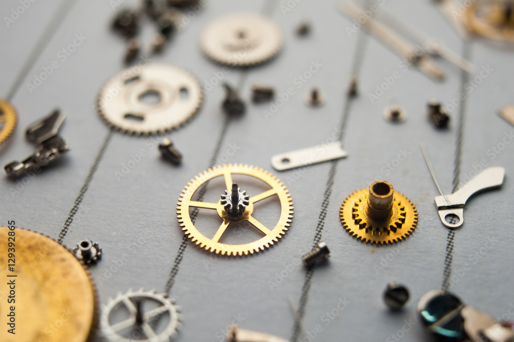 Detail of watch machinery on the table. Detail of watch machinery on the table.