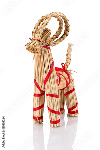 Yule Goat or Christmas goat is a Scandinavian and a Northern European Yule and Christmas symbol and traditional christmas decoration. Viewed from the side. Isolated on white background.