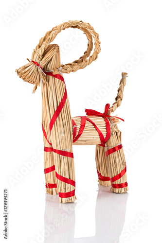 Yule Goat or Christmas goat is a Scandinavian and a Northern European Yule and Christmas symbol and traditional christmas decoration. Viewed from the side. Isolated on white background.