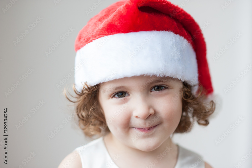 portrait of little cute girls in Santa hat portrait of little cute girls in Santa hat