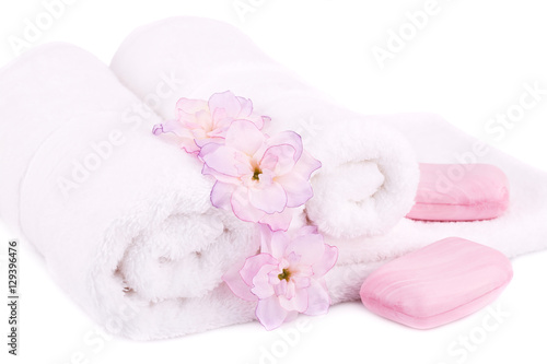 Towel, soaps and flowers