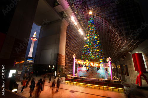 Big christmas tree with illumination light and kyoto tower at Kyoto station Japan
